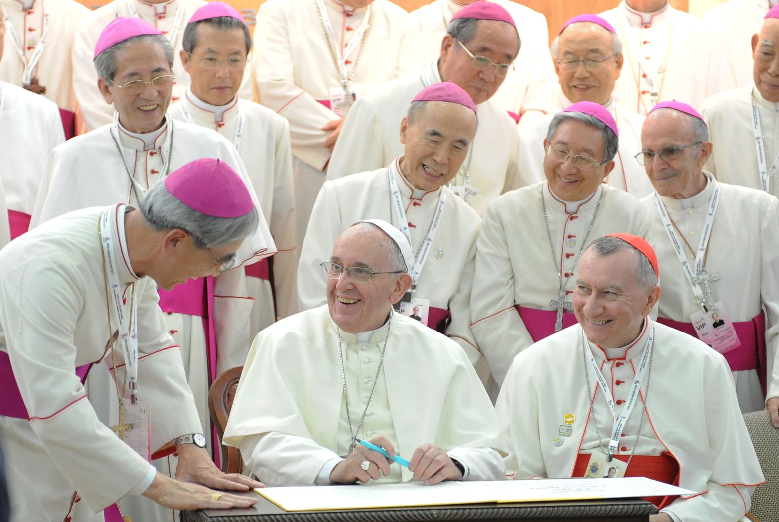 The Pope signs a guestbook while meeting with bishops in Seoul, South Korea, in August 2014.