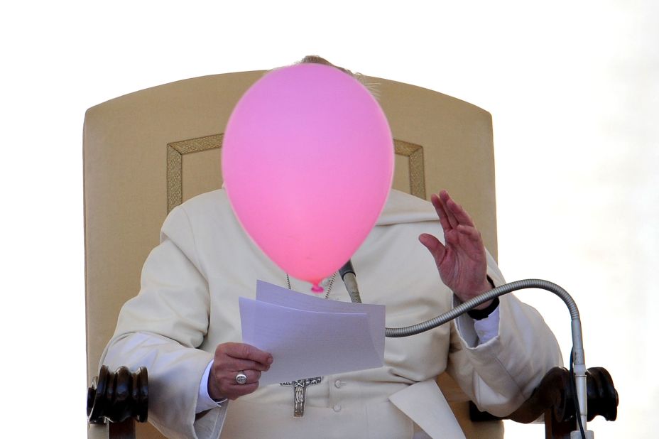 A balloon flies past the Pope during his general audience in St Peter's Square in May 2014.