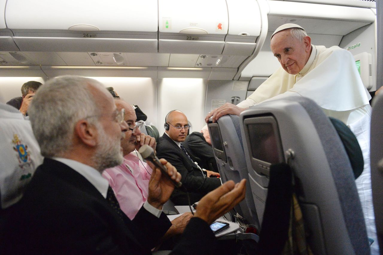 The Pope answers reporters' questions while flying back from a trip to Brazil in July 2013. During the impromptu news conference, the Pope said that he would not "judge" gays and lesbians, including gay priests. "If someone is gay and he searches for the Lord and has good will, who am I to judge?" he said. Many saw the move as the opening of a more tolerant era in the Catholic Church.
