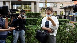Teresa Xu, also known as Xu Zaozao, speaks to journalists at Chaoyang People's Court before a court hearing in her suit against a Beijing hospital for refusing to freeze her eggs because she is unmarried in Beijing on September 17, 2021. (Photo by Jade GAO / AFP) (Photo by JADE GAO/AFP via Getty Images)