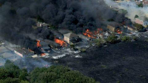 Flames spread to at least 14 homes in Balch Springs, about 15 miles southeast of Dallas.