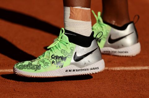 Williams wears custom Nike sneakers at the French Open in 2021. Williams partnered with Nike to launch a <a href="https://www.cnn.com/2021/08/17/business/nike-serena-williams-swdc/index.html" target="_blank">collection of athleisure wear</a> created by emerging designers.