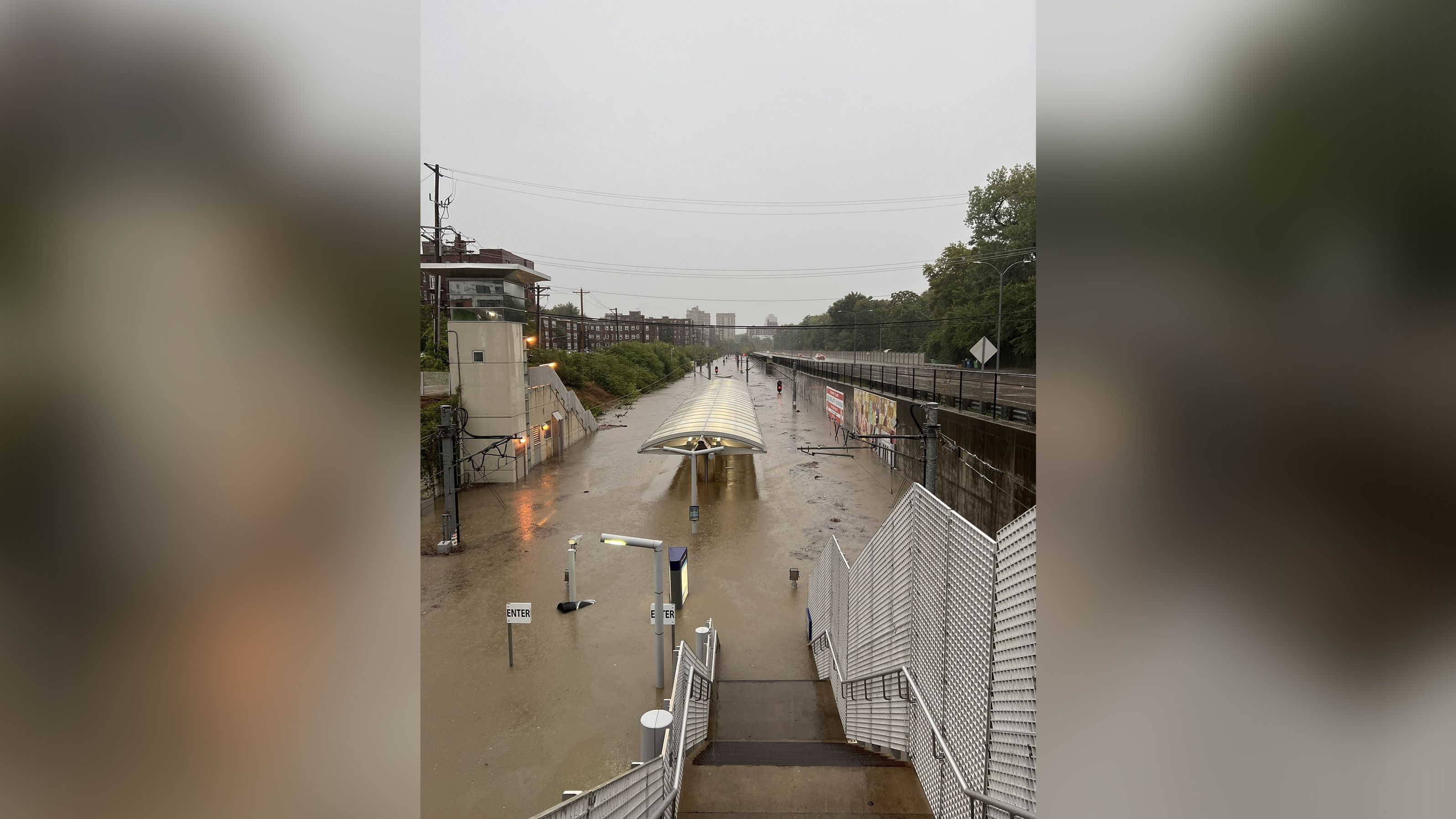  Water covers much of MetroLink's Forest Park-DeBaliviere station in St. Louis on Tuesday morning.