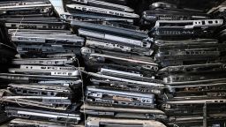 Old laptop casings are stacked on shelves in the local NGO Electronic Waste Initiative Kenya (E-WIK) workshop as the NGO collects electronic wastes to be processed, recycled, and repurposed in an informal settlement in Nairobi, Kenya, on December 3, 2021.