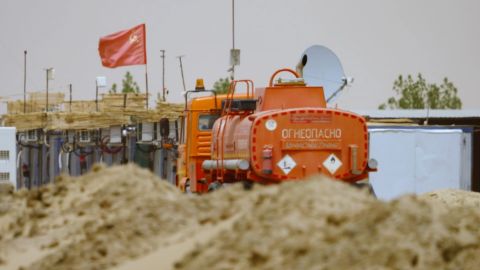 A Soviet flag flies over the processing plant deep in the Sudanese desert, a facility known to locals as the 