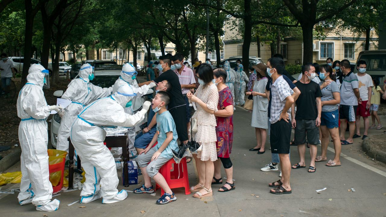 Residents line up to be tested for Covid-19 in Wuhan, central China's Hubei province on August 3, 2021. 