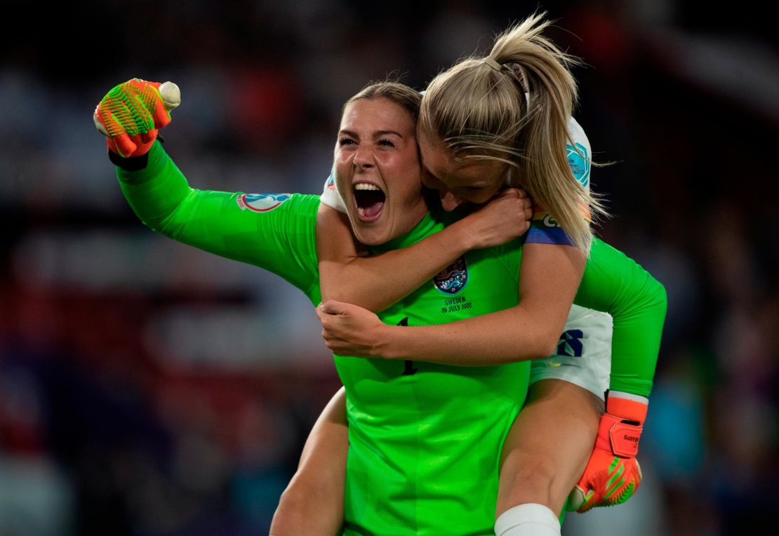 England goalkeeper Mary Earps and defender Leah Williamson celebrate their team's third goal against Sweden.