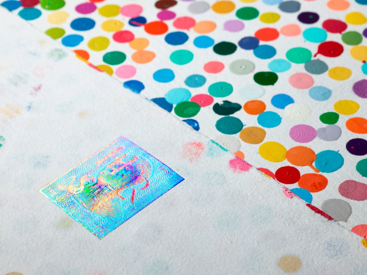 Last year, Hirst issued NFTs for 10,000 of his signature "spot" paintings.