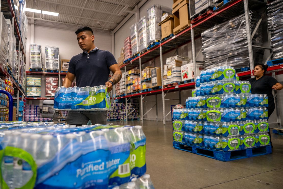 A customer stocks up on bottled water in a Sam's Club during a heatwave in Houston, Texas. 