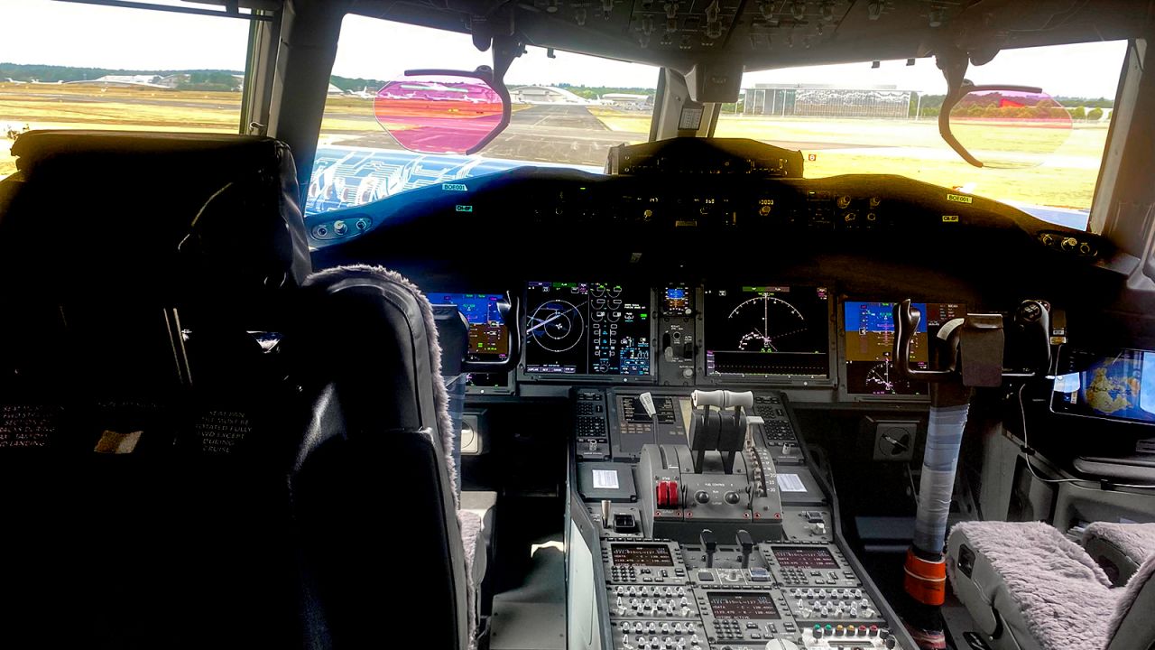 <strong>Cockpit view:</strong> The flight deck features touchscreen displays, which can support multiple touch points, allowing two pilots to interact with their section of the lower display simultaneously.