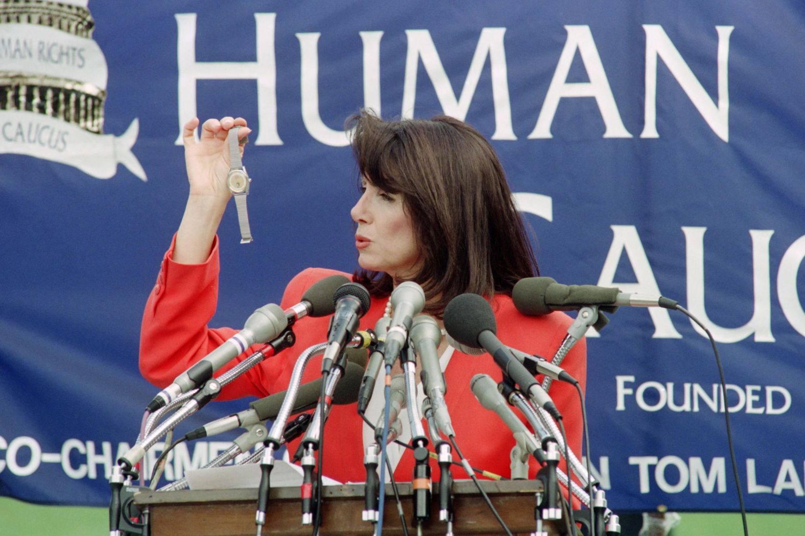 Pelosi, speaking at the US Capitol in June 1991, holds a watch that was reportedly smuggled out of China. She said the watches were given to soldiers who helped crush the Tiananmen Square protesters in 1989.