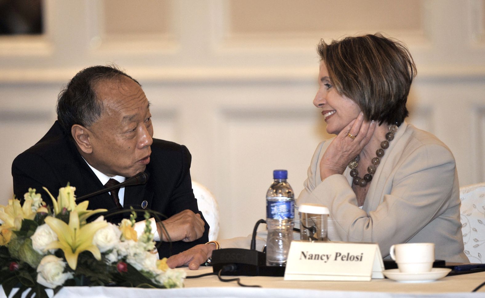 Pelosi chats with Li Zhaoxing, former Chinese foreign minister, at a clean energy forum in Beijing in May 2009. In a speech, Pelosi called for closer cooperation in fighting global warming.