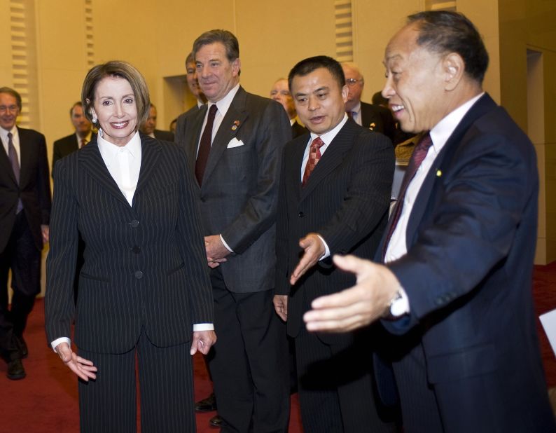 Li, right, shows Pelosi the way after she arrived at a joint session involving committees from China and the United States in May 2009.