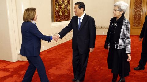Pelosi shakes hands with Zhang Ping, vice vhairman of China's National People's Congress, as she arrives for a bilateral meeting at the Great Hall of the People in Beijing in November 2015. At right is Fu Ying, head of the NPC's foreign affairs committee.