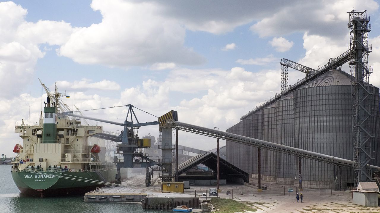 A cargo ship is loaded beside grain silos in an Odesa port in 2013.