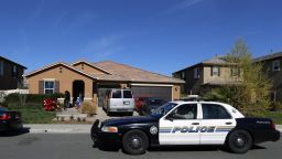A police car drives past the home of David and Louise Turpin where police arrested the couple accused of holding 13 children captive on Jan. 24, 2018, in Perris, Calif. A report released Friday, July 8, 2022, says the social services system "failed" the 13 children who were rescued after being starved, shackled to beds and horribly abused by their parents the Turpin's at their Southern California home for years.