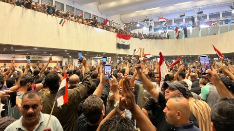 Iraqi demonstrators after storming the fortified Green Zone where government buildings are located in Baghdad.