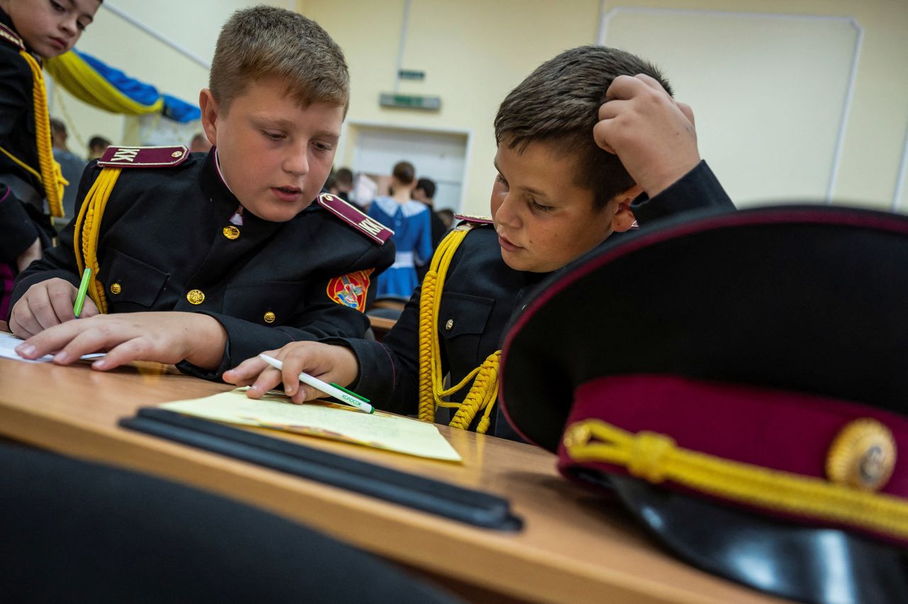 Students at a military school write letters to Ukrainian servicemen during a lesson in Kyiv, Ukraine, on July 27.  Zelensky says Russia waging war so Putin can stay in power &#8216;until the end of his life&#8217; 220727140737 03 ukraine gallery update