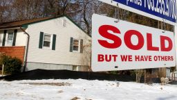 FILE PHOTO: A "SOLD" sign hangs in front of a house in Vienna in Virginia March 27, 2014. REUTERS/Larry Downing/File Photo