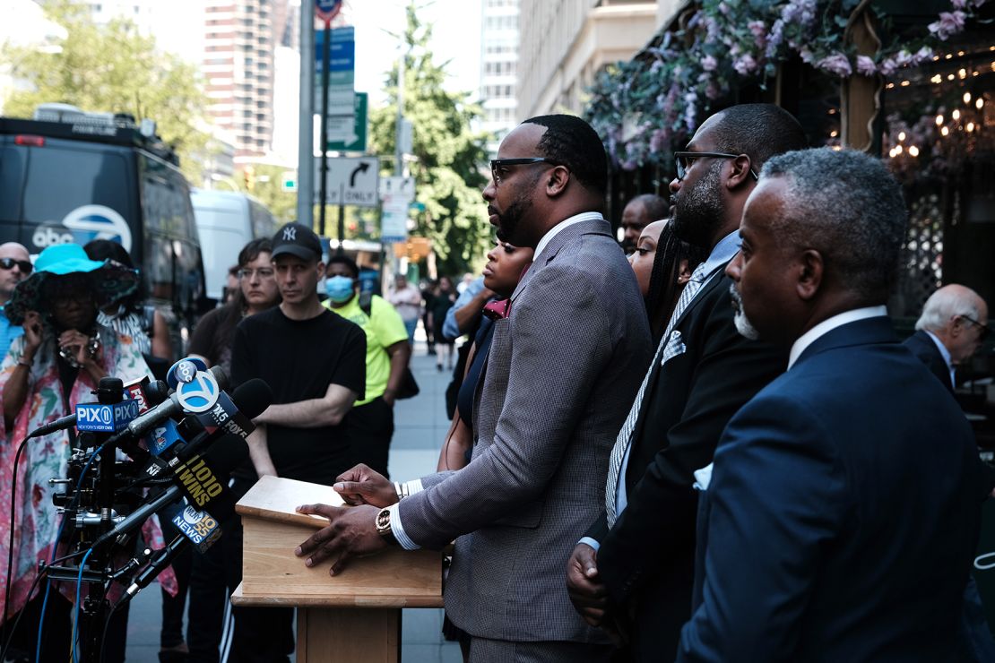 Lawyer B'Ivory Lamarr stands with community activists and members of the family of the two young girls who he claims were ignored by a Sesame Place actor dressed as Rosita at Sesame Place in Philadelphia due to their race on July 20, 2022, in New York City.