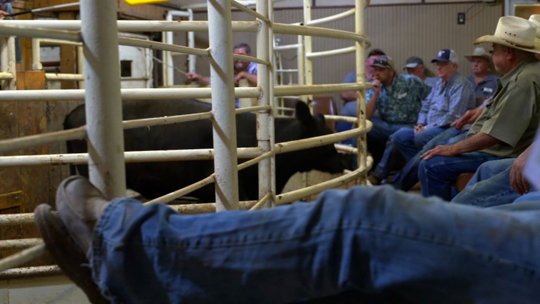 Buyers and sellers attend a livestock auction in Seguin, Texas, on July 27, 2022.