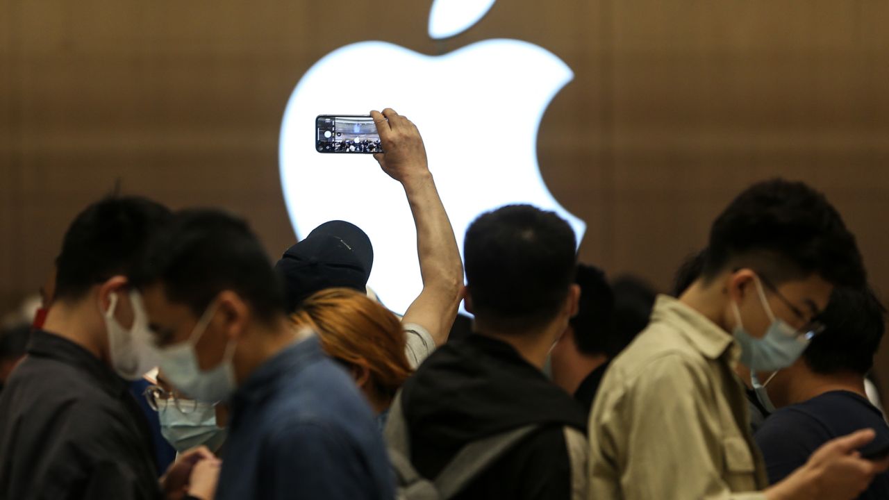 Customers line up to enter a new Apple store at Wuhan International Plaza on May 21, 2022 in Wuhan, Hubei Province of China. 