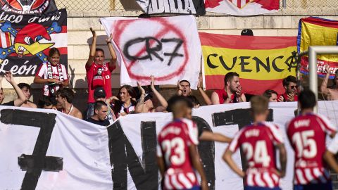 BURGOS, SPAIN - JULY 27: Fans of Atletico de Madrid display a sign against Cristiano Ronaldo during the pre-season friendly match between Numancia and Atletico de Madrid at Estadio Burgo de Osma on July 27, 2022 in Soria, Spain. (Photo by Diego Souto/Quality Sport Images/Getty Images)