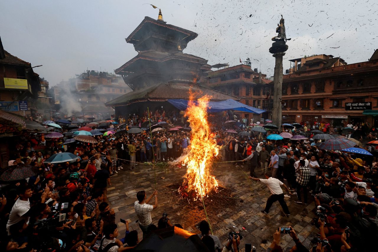 An effigy of the demon Ghantakarna is burned during the Ghantakarna festival in Bhaktapur, Nepal, on Tuesday, July 26. The burning is meant to symbolize the destruction of evil and drive out evil spirits and ghosts. 