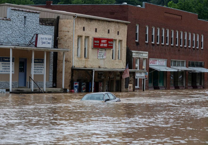 A car is submerged in floodwaters along Right Beaver Creek in Garrett.