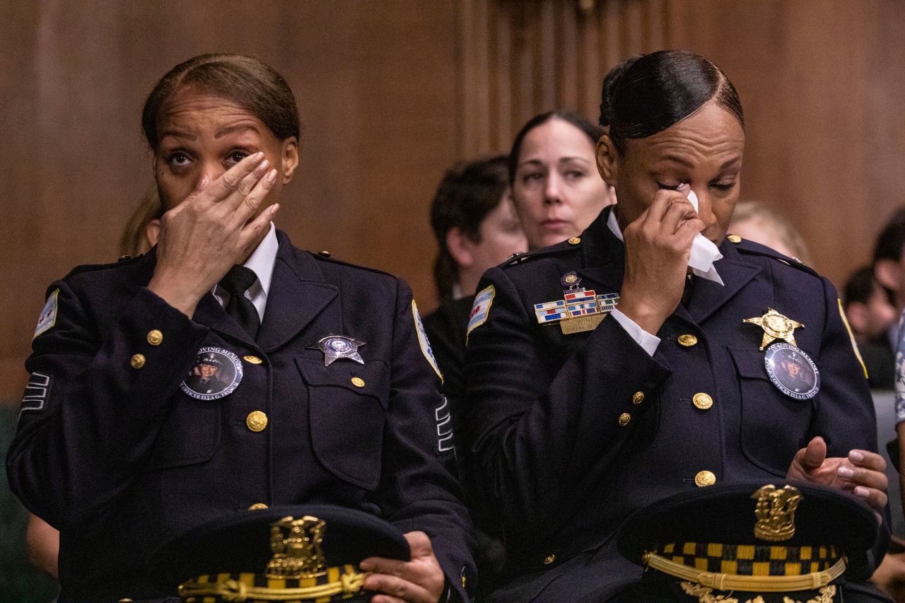 Officers from the Chicago Police Department, wearing buttons that depict fallen Chicago police officer Ella French, tear up during a Senate Judiciary Committee hearing about law enforcement safety on Tuesday, July 26. <a href="https://www.cnn.com/2021/08/12/us/chicago-police-officers-shot-ella-french/index.html" target="_blank">French was shot in the line of duty</a> during a traffic stop last year.