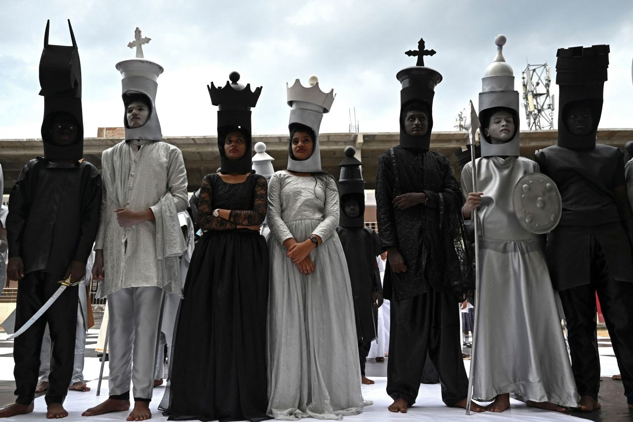 Children dressed as chess pieces perform before the Chess Olympiad in Chennai, India, on Tuesday, July 26.
