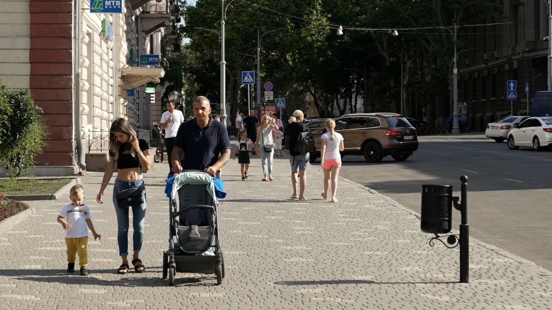 Five months into the war, many Ukrainians are embracing normal life. People still go to work, walk their dogs and play with their children in the park.
