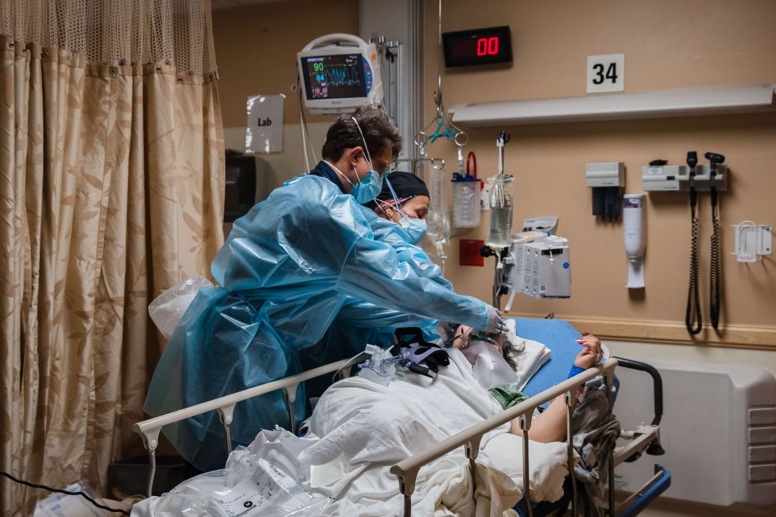 A stressful 2 1/2 years led some to reevaluate their lives. Here, health care workers check a Covid-19 patient.