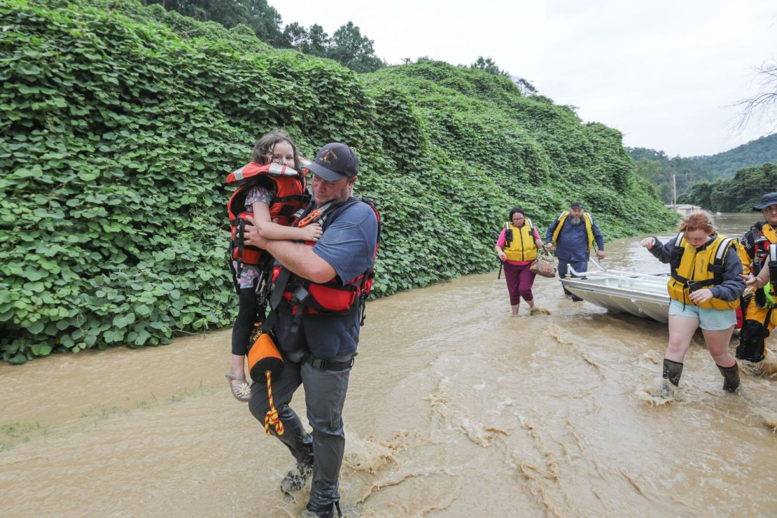 A group of stranded people are rescued from the flood waters in Jackson, Kentucky.