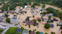 An aerial view shows homes submerged under flood waters from the North Fork of the Kentucky River in Jackson, Kentucky, on July 28, 2022.