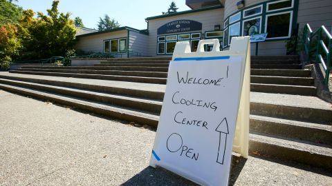 A sign welcomes visitors seeking relief from the heat Tuesday at Charles Jordan Community Center in Portland, Oregon.