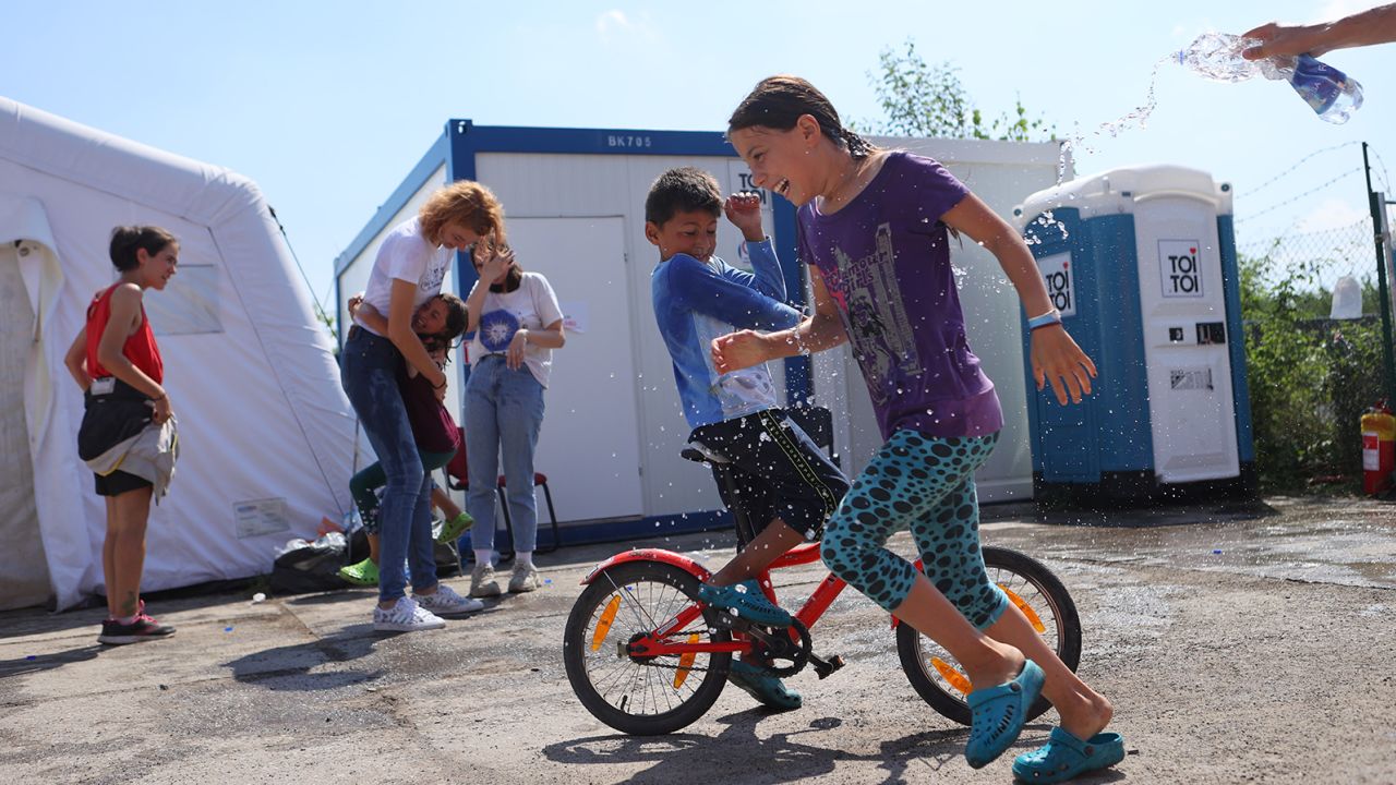 Children play in a refugee camp in Prague. Second from left is Nikol Hladikova, the social worker responsible for the camp's operations.
