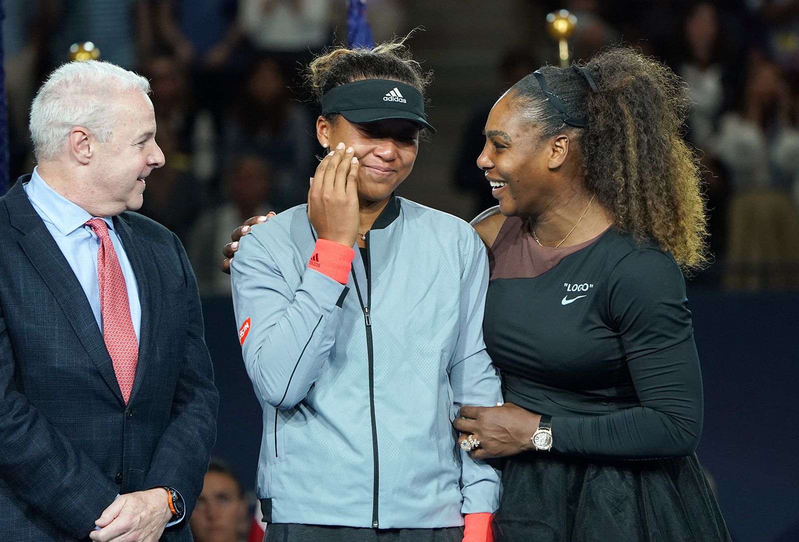 Williams consoles Osaka, who was in tears after her US Open win in 2018. Osaka had denied her idol of a 24th grand slam title, and fans were booing after Williams had clashed with the chair umpire during the match.