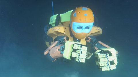 Stanford University's OceanOneK diving robot explores a shipwreck.