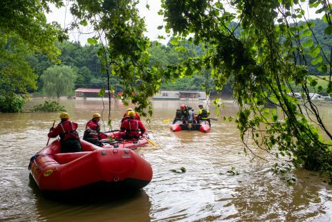 Lexington firefighters' swift-water rescue teams work in Lost Creek, Kentucky, on Friday.