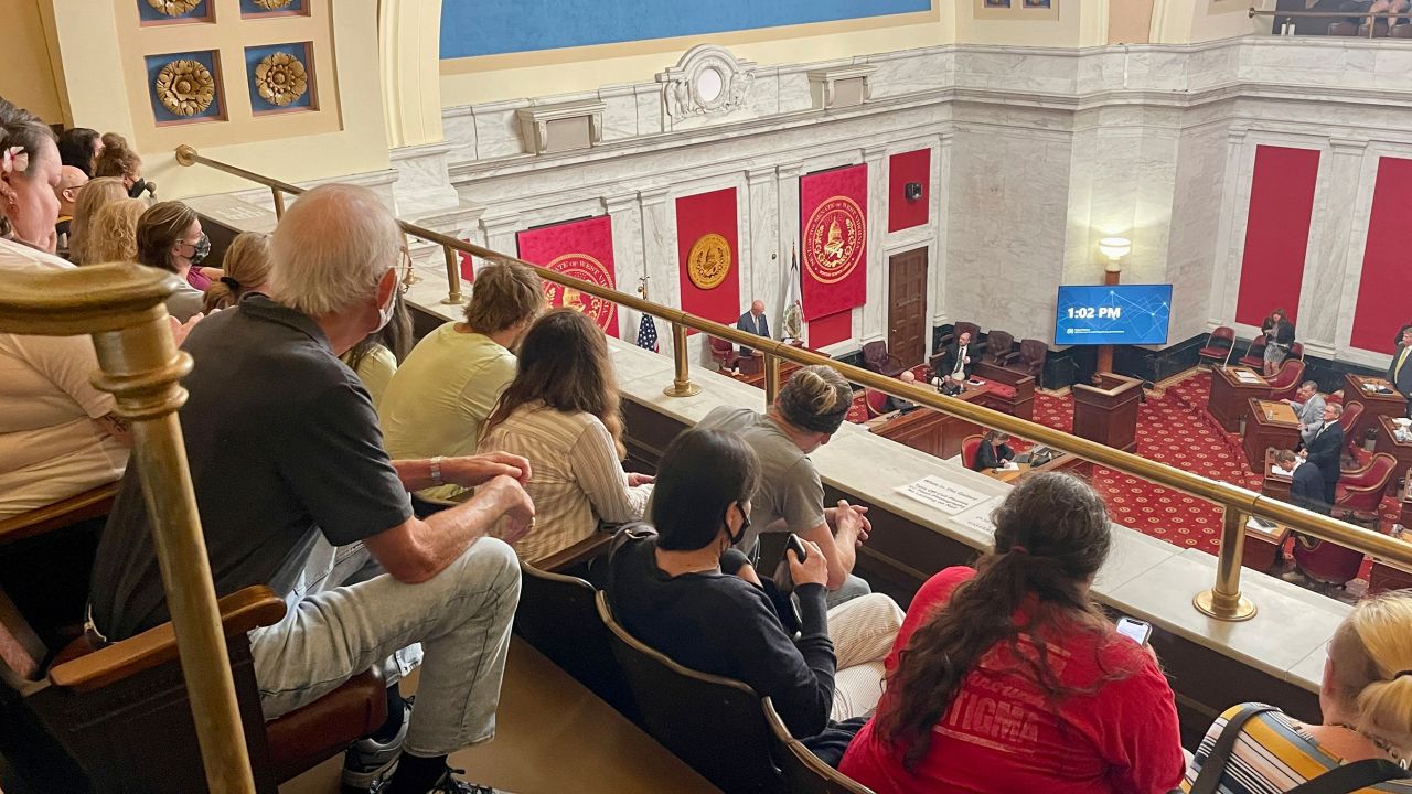 Members of the public watch the start of a West Virginia Senate hearing to discuss an abortion bill on July 29, 2022, at the state Capitol in Charleston, West Virginia.