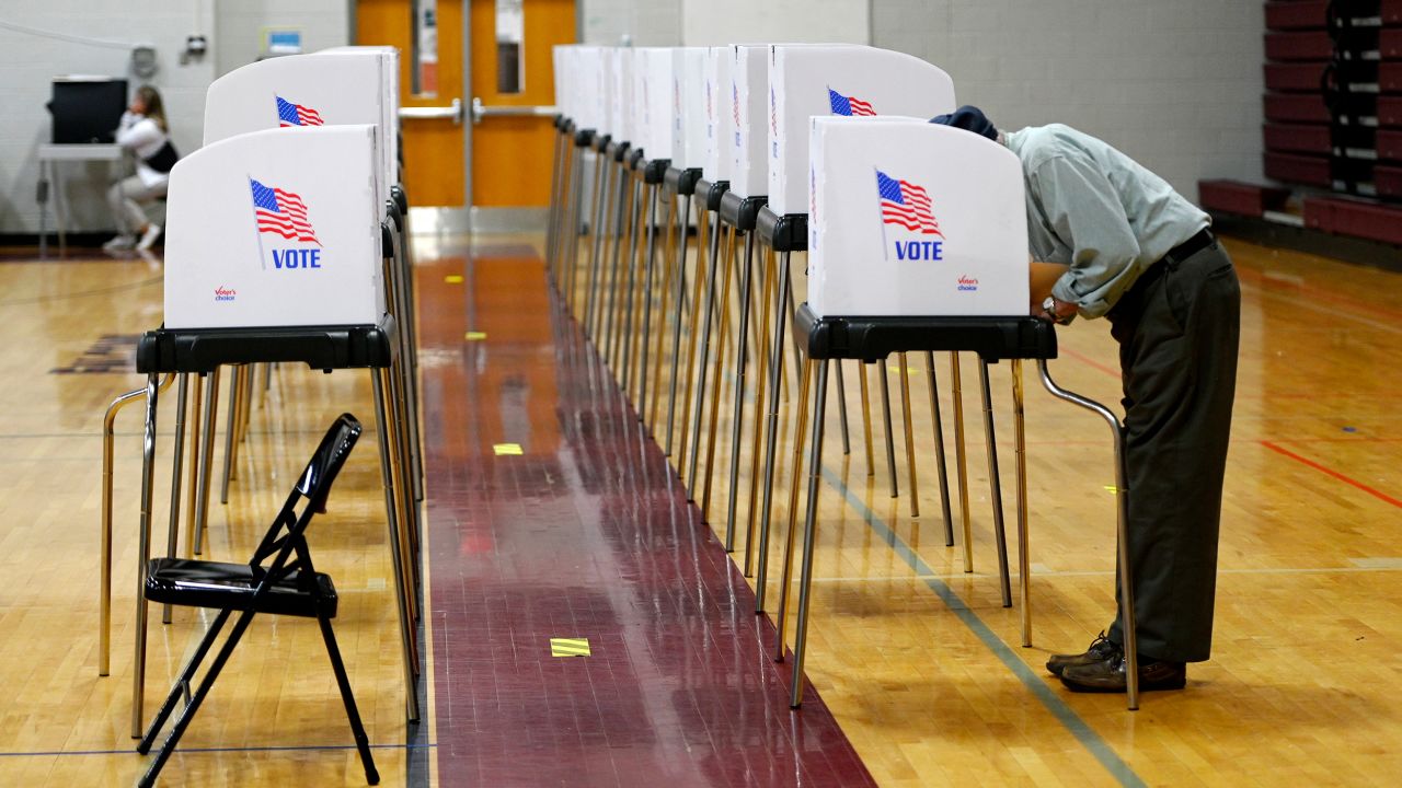 A person marks his ballot while voting in Maryland's primary election at Winters Mill High School in Westminster on July 19, 2022.