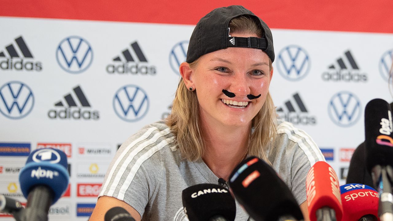 Alexandra Popp wore a fake mustache to her pre-match press conference on Friday.