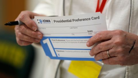 A volunteer holds a Presidential Preference Card before the start of a Democratic caucus at Hoover High School in Des Moines, Iowa, on February 3, 2020.