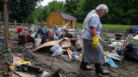Libby Duty, 64, of Jenkins, Kentucky walked through her back yard while clearing out her basement on Saturday after historic rains flooded many areas of eastern Kentucky.