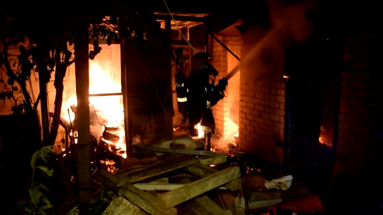 A firefighter battles a fire following shelling in Mykolaiv, Ukraine, on Sunday, July 31.