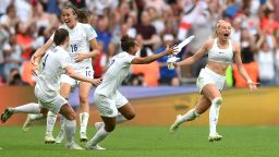 LONDON, ENGLAND - JULY 31: Chloe Kelly of England celebrates with teammates after scoring their side's second goal in extra time during the UEFA Women's Euro 2022 final match between England and Germany at Wembley Stadium on July 31, 2022 in London, England. (Photo by Shaun Botterill/Getty Images)