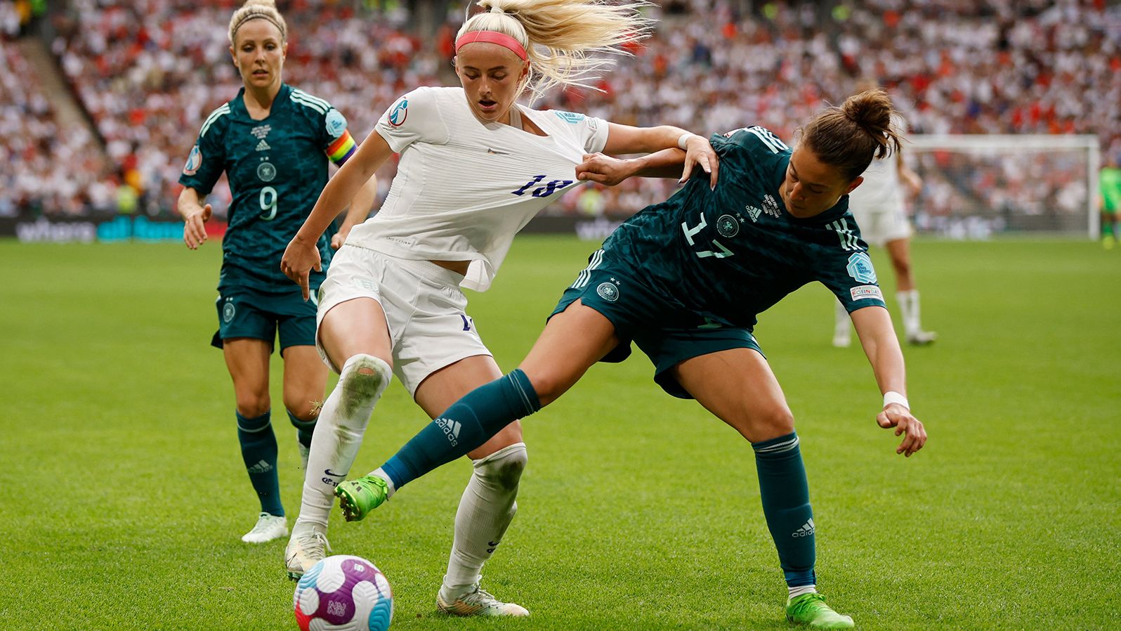 England's Chloe Kelly fights for the ball with Germany's Felicitas Rauch on Saturday. 