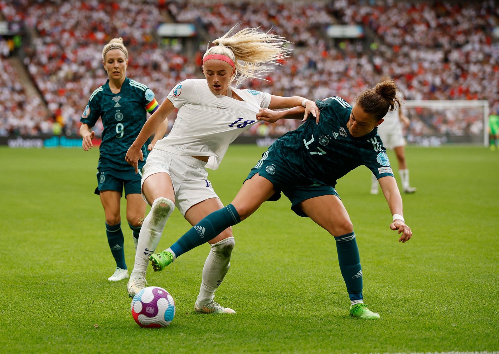 England's Chloe Kelly fights for the ball with Germany's Felicitas Rauch on Saturday.