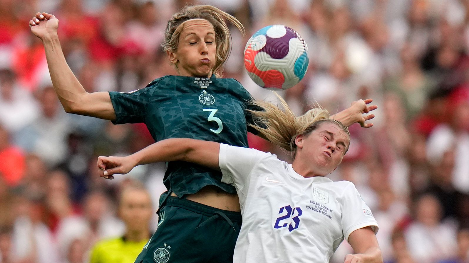 England's Alessia Russo, right, vies for the ball with Germany's Kathrin-Julia Hendrich.